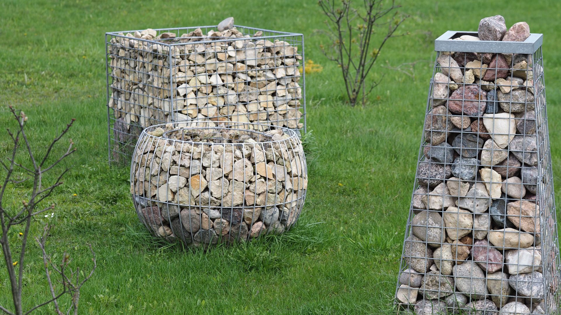Three gabions made from steel mesh.