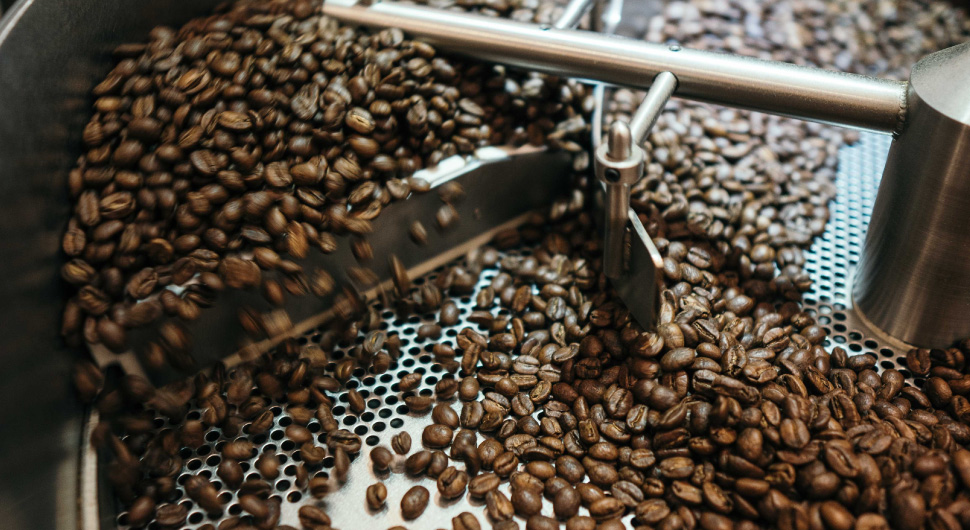 Coffee beans being mechanically sorted.