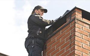 woman-installing-chimney-cap