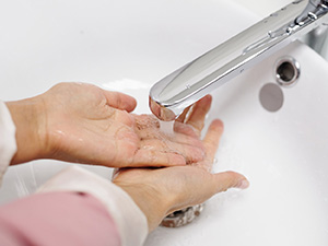 Woman washing her hands