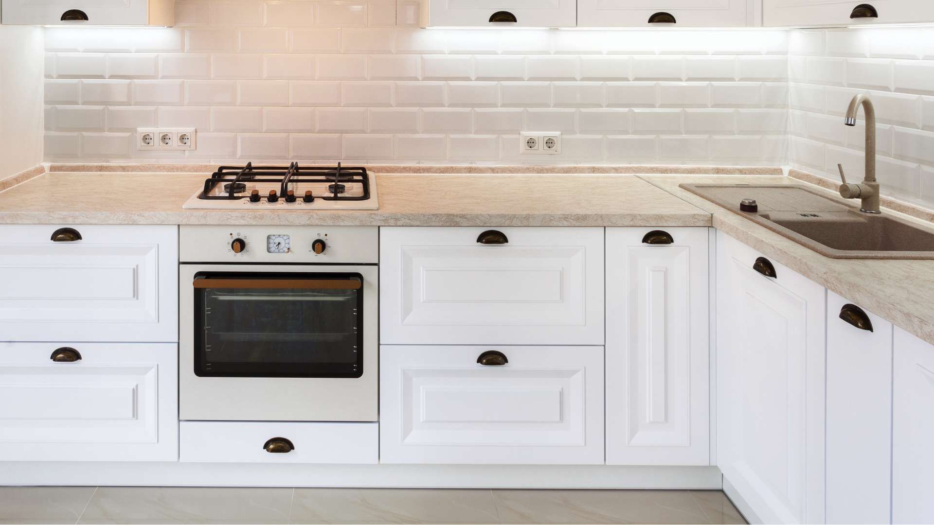 white kitchen with under cabinet lighting